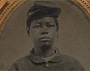Unidentified young African American soldier in Union uniform with forage cap